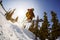 The skier jumps from a springboard in the ski resort.