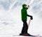 Skier makes selfie on camera phone and snowy mountain in fog