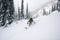 skier making a smooth turn on snow-covered trail