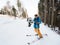 Skier man taking selfie with stick. Focus on his camera