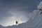 Skier on a mountain ridge in the winter