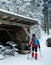 Skier near the garage of the modern snow plough in Mummelsee