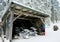 Skier near the garage of the modern snow plough in Mummelsee