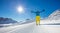 Skier on piste in sunny day. Skiing concept.