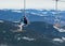 Skier on a platform on a background of high snow mountains