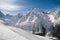 Skier rides along the ski run against the backdrop of the beautiful Caucasus Mountains