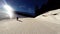 A skier rides down a difficult ski run on a sunny day in the French Alps,