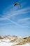 Skier rides with snow kite. Vertical view.