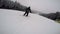 A skier rides in winter, snow-covered mountain slope on skis