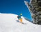 Skier riding in the mountains on a sunny winter day