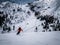 Skier riding in snow in piste downhill in the Italien Alps