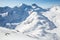 Skier ripping down a long run through the Alaska backcountry above the Snowbird Glacier in the Talkeetna Mountains