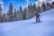 Skier running down the slope in Karakol mountains