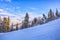 Skier running down the slope in Karakol mountains.