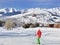 Skier on ski slopes in french alps resort and chair lift