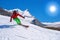 Skier skiing downhill in high mountains, Matterhorn, Switzerland