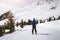 Skier skiing on easy blue trail with beautiful landscape