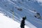 Skier skiing high mountains in fresh powder snow, Mt. Titlis, Switzerland