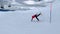 Skier skiing on ski on springboard on snowy slope and falling slow motion