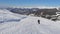 Skier Slaloms Down A Snowy Slope In The Mountains