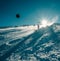 Skier slides down on the snow slope