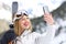 Skier taking a selfie with a smartphone