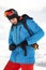 Skier tightening his backpack belt