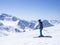 Skier at the top of Schaufelspitze mountain at Stubai Gletscher ski resort preparing to go down into the valley. Snow