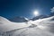 Skier tracks in fresh snow alone