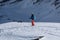 Skier viewing way ahead into snow covered valley in remote location in Alps