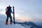 A skier watching the sunset.