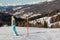 Skier with white Helmet Ready for Skiing in Ski Slope, Italian Dolomites Mountains in background