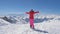 Skier Woman Raises Arms And Turning Then She Falls On Snow Background Mountains