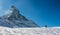 Skier in Zermatt in front of the Matterhorn view mountain winter snow landscape sunset backlight