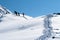 Skiers ascending on a mountain