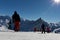 Skiers on beautiful ski slope in Alps, people on winter holidays. Winter mountain landscape