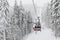 The skiers are on a cableway in Bukovel ski resort