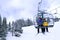 Skiers on chairlift