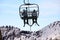 Skiers on chairlift