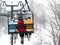 Skiers on chairlift