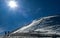 Skiers climbing up to the summit of Emperial bowl area of Breckenridge ski resort. Extreme winter sports.