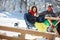 Skiers couple resting and drinking in cafe outdoor