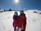 Skiers couple on white skiing terrain