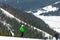 Skiers descend on the slopes of the Carpathian slopes and mountains, on the background are picturesque scenery and ski slopes