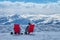 Skiers enjoy in sunbed after skiing on top of a mountain, Alps, Switzerland