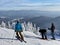 Skiers getting ready to ski down the slopes at beautiful snow day at the Stowe Mountain Ski resort