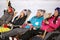 Skiers group sunbathing in sunbed on ski terrain