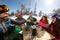 Skiers group toasts with drinks in cafe on ski terrain