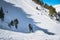 Skiers having fun on steep piste in Pyrenees Mountains. Winter ski holidays in Andorra