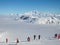 Skiers looking at the Mont Blanc over a sea of clouds